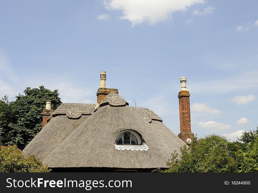 Rural house against blue sky in summer season. Rural house against blue sky in summer season