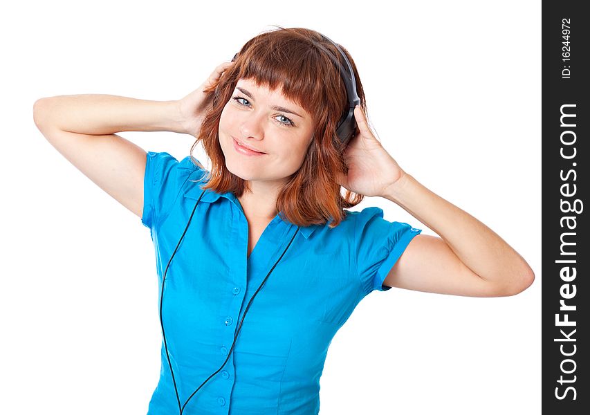 Young red-haired girl listen to music and dance. Isolated on white background