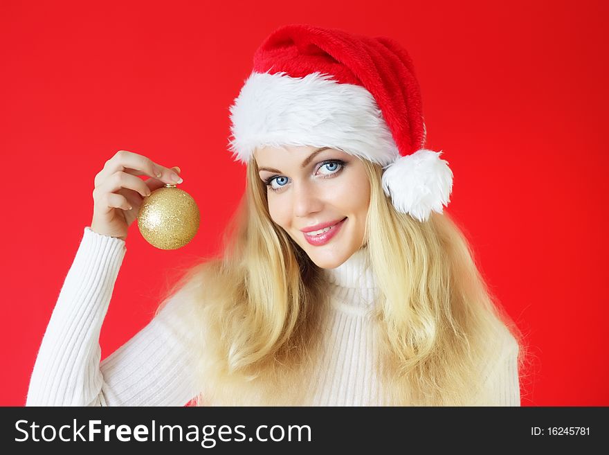 Attractive girl holding a Christmas ball