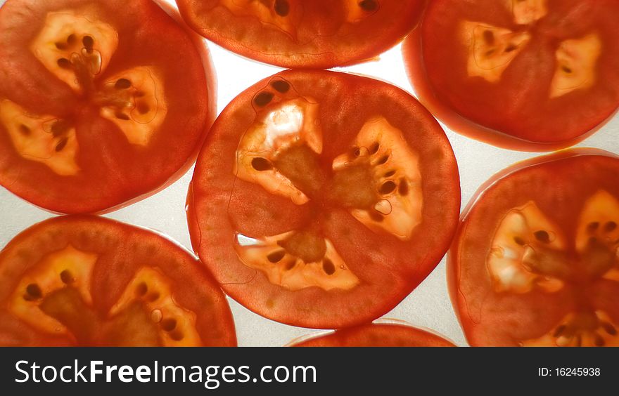 Close-up tomatoes cut in slices. Close-up tomatoes cut in slices