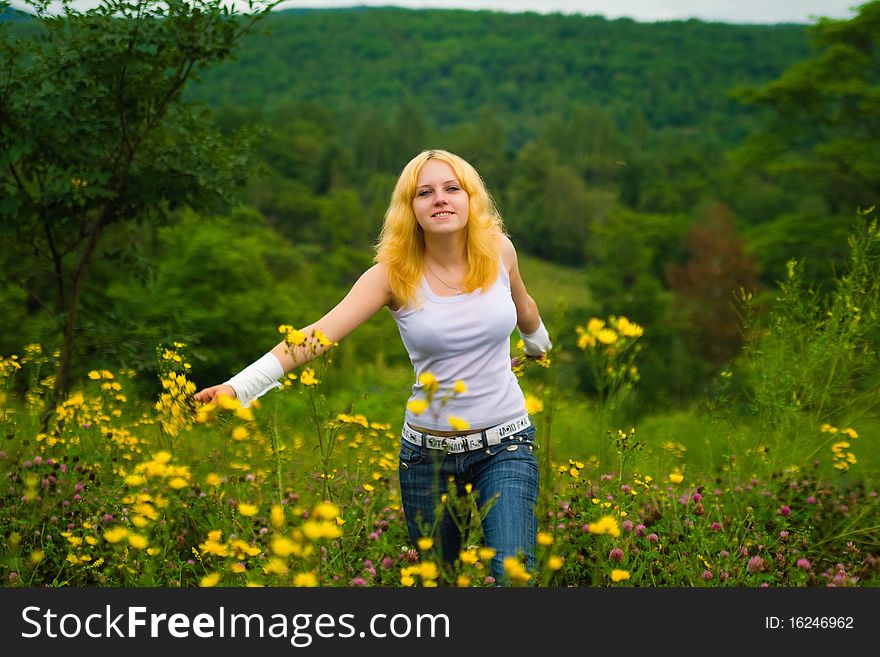 Girl, yellow flowers and grass. Girl, yellow flowers and grass
