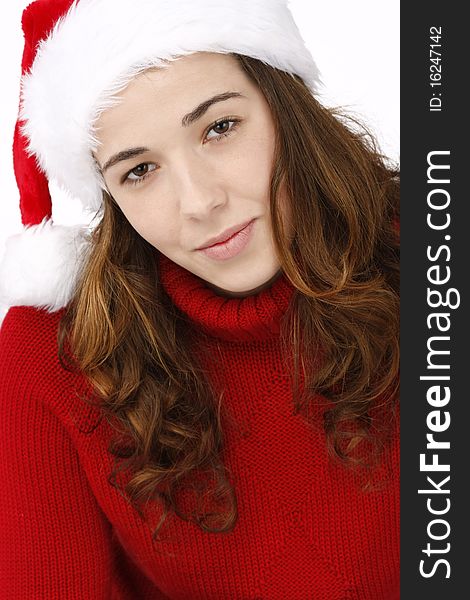 Portrait of a beautiful young woman wearing santa hat