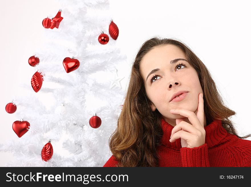 Beautiful Young Woman Next To Christmas Tree