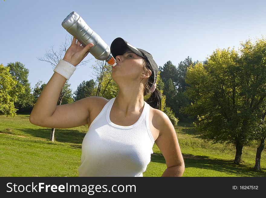 Nice looking girl is drinking water