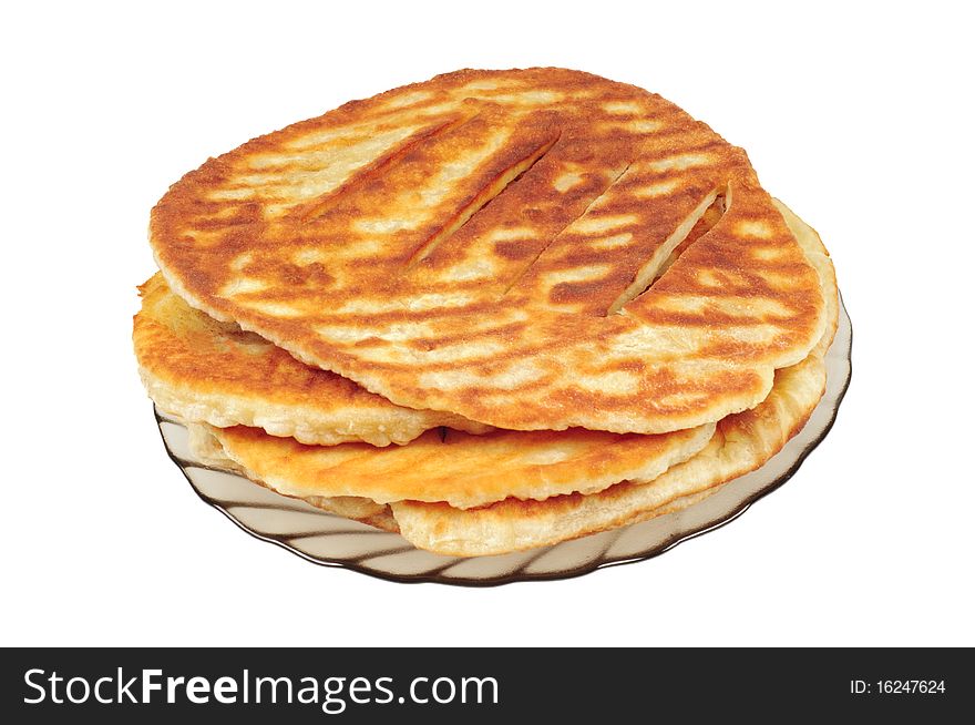 Baked tortillas on a plate, isolated on white.