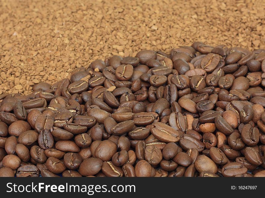 Natural coffee grain and pellets of soluble. Natural coffee grain and pellets of soluble