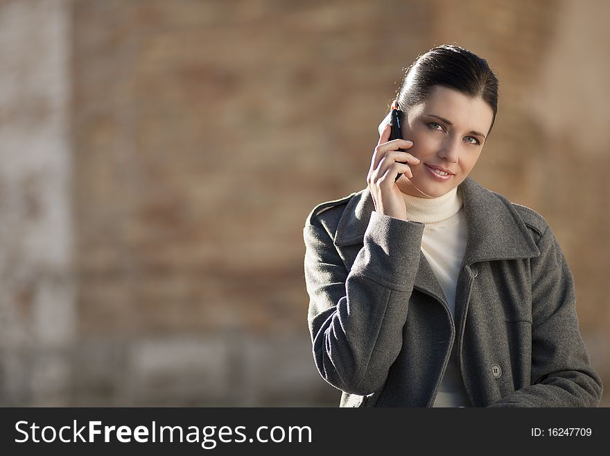 Young business woman on mobile phone. Young business woman on mobile phone