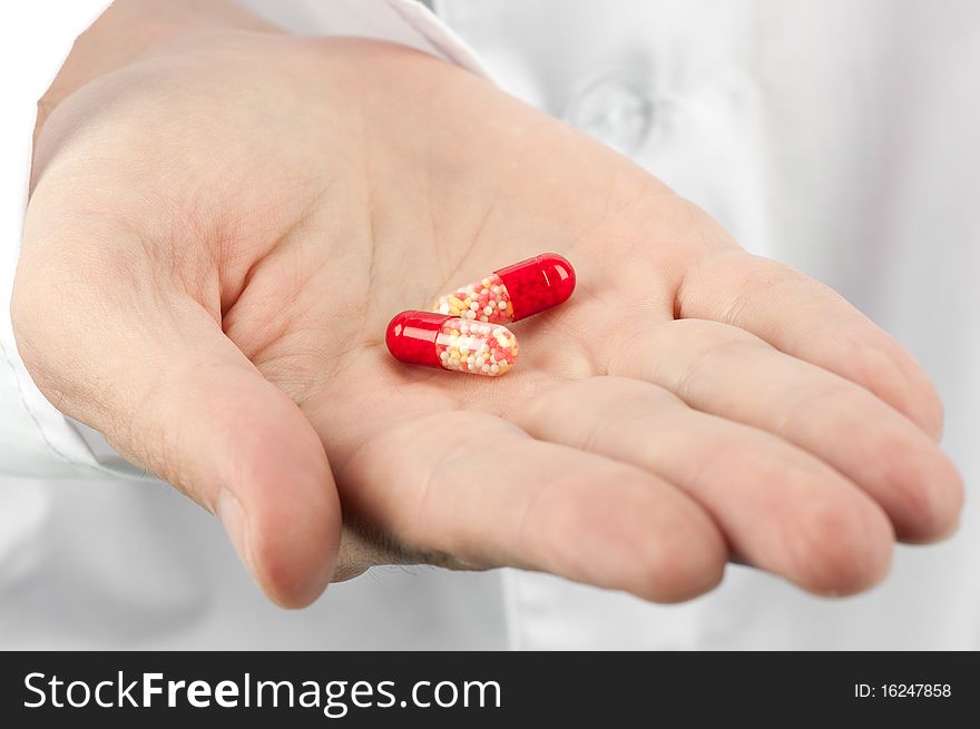 Medical pills in hand closeup