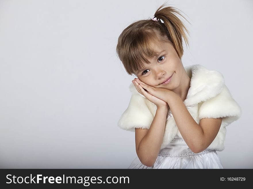 Adorable little girl gesturing sleep