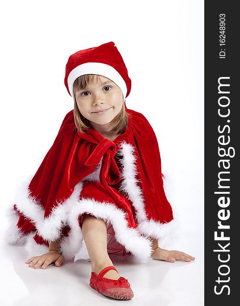 Portrait of a pretty 5 years old girl, wearing Christmas outfit or Santa's helper, studio image. Portrait of a pretty 5 years old girl, wearing Christmas outfit or Santa's helper, studio image
