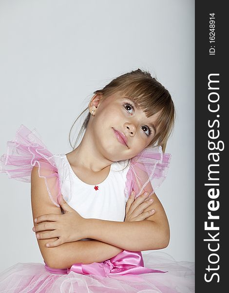 Portrait of a beautiful little ballerina looking sideways, studio image. Portrait of a beautiful little ballerina looking sideways, studio image