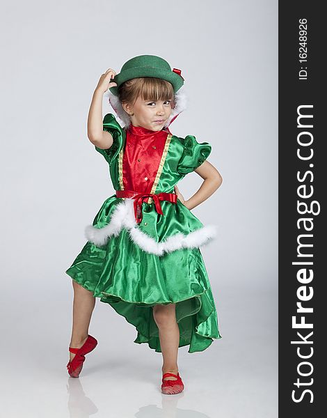 Full length portrait of an adorable little girl wearing green outfit and hat for Saint Patrick's Day, studio image. Full length portrait of an adorable little girl wearing green outfit and hat for Saint Patrick's Day, studio image