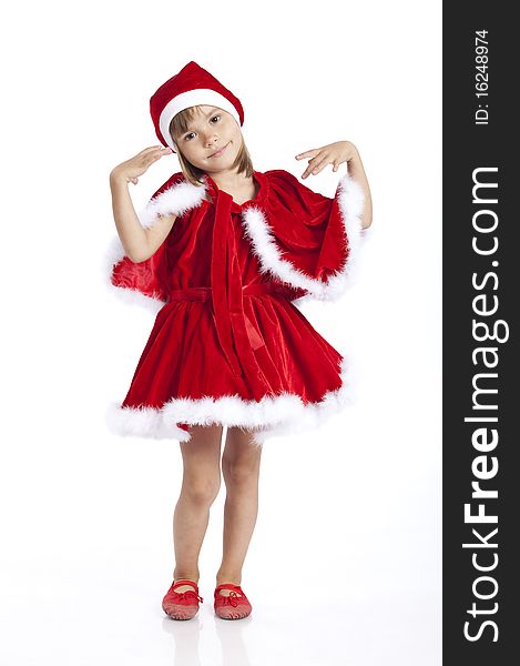 Full length portrait of a little girl wearing Santa helper costume, gesturing and smiling, studio image. Full length portrait of a little girl wearing Santa helper costume, gesturing and smiling, studio image