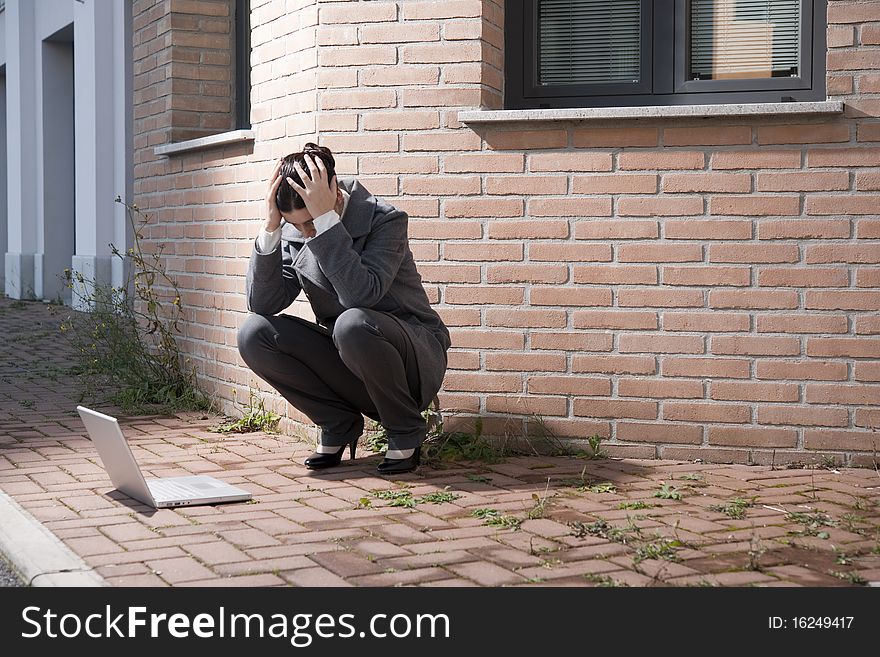 Businesswoman working with laptop outdoors. Businesswoman working with laptop outdoors