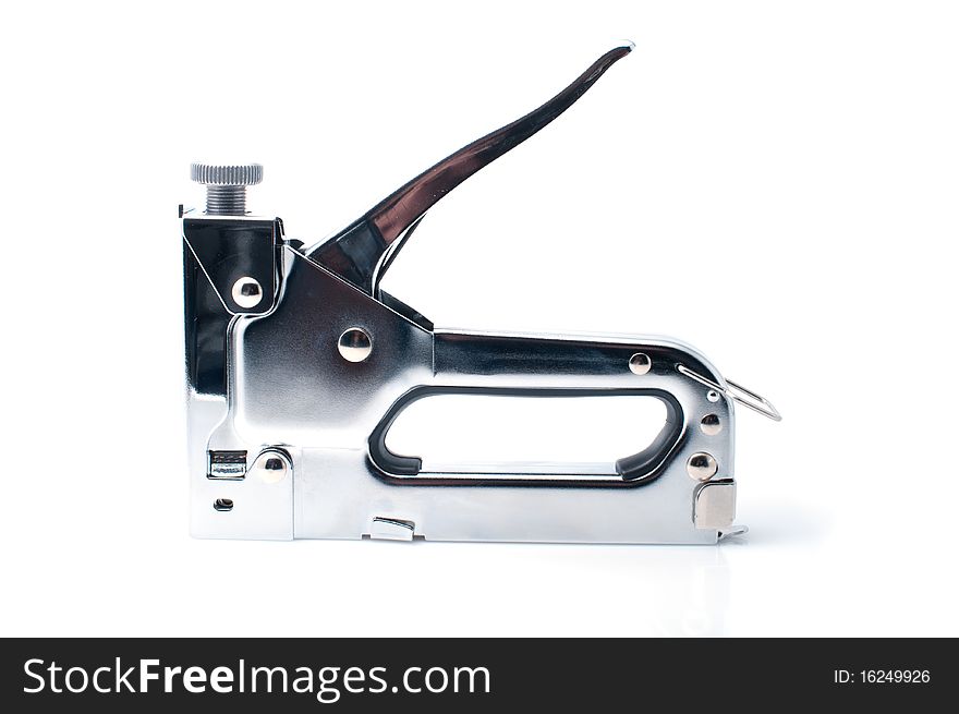 Stapler for repair of furniture on a white background. Stapler for repair of furniture on a white background
