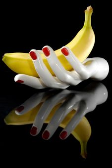 Hand And Banana Royalty Free Stock Photo