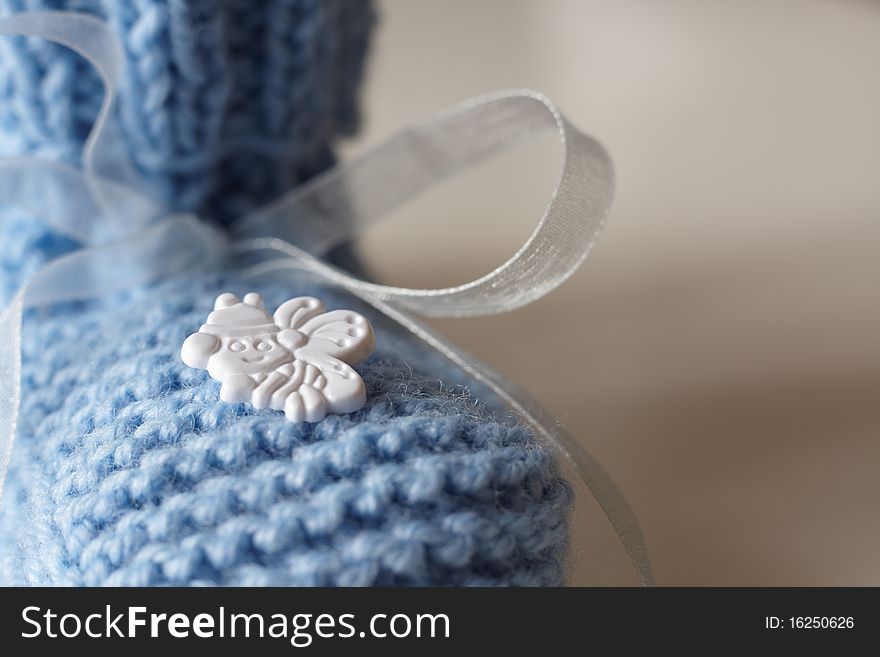 Closeup of blue baby's bootee