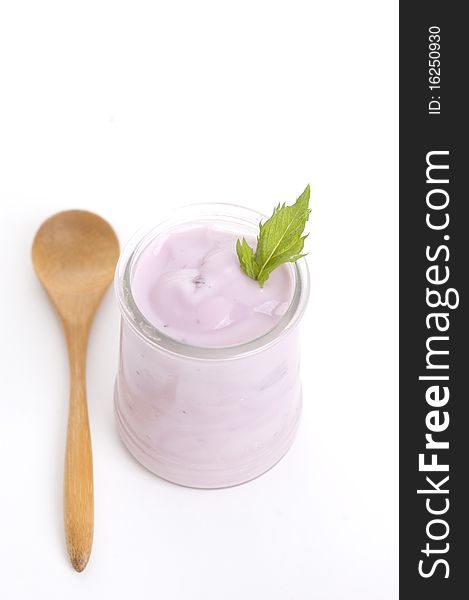 Bowl of blueberry yoghurt isolated on white background