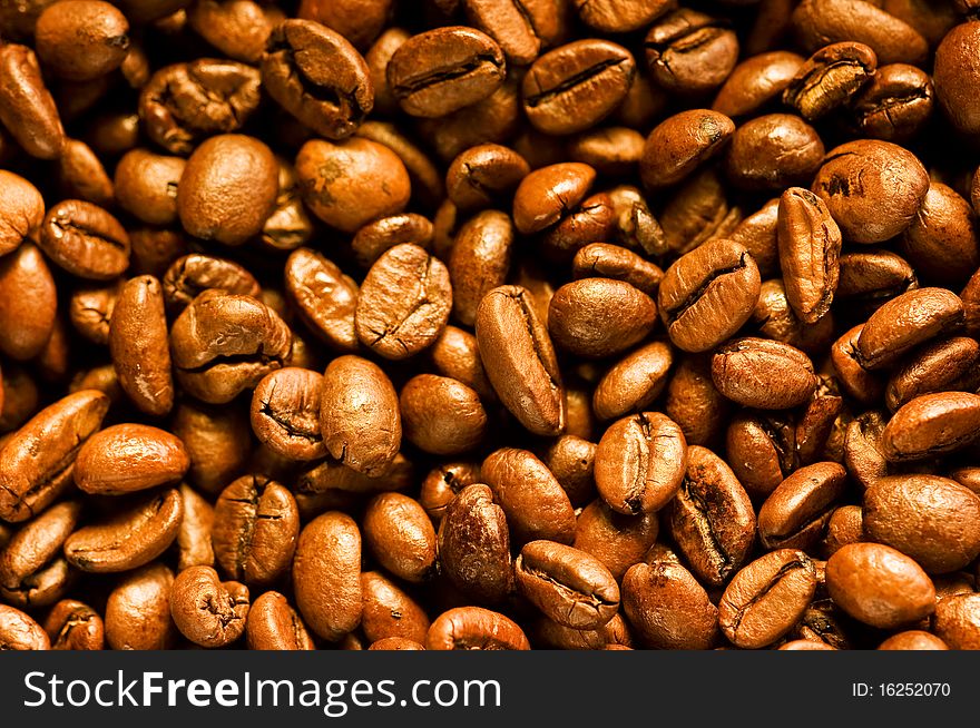 A lot of brown good smelling coffeebeans. A lot of brown good smelling coffeebeans