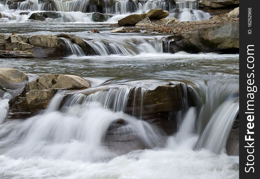 Mountain stream and brown rocks. Mountain stream and brown rocks.