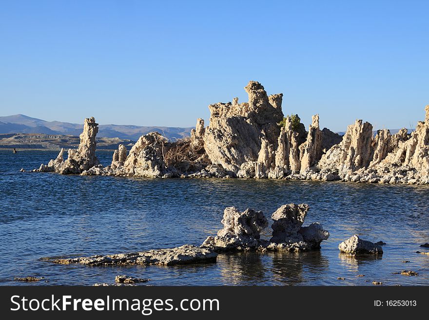 Tufa towers rising above Mono Lake. The towers are formed by calcium rich freshwater springs flowing into the alkaline lake water. The towers have been exposed due to the lowered lake level. Tufa towers rising above Mono Lake. The towers are formed by calcium rich freshwater springs flowing into the alkaline lake water. The towers have been exposed due to the lowered lake level.