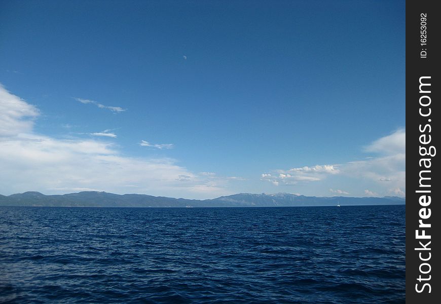 A view of the lake on the lake with a blue sky to match. A view of the lake on the lake with a blue sky to match