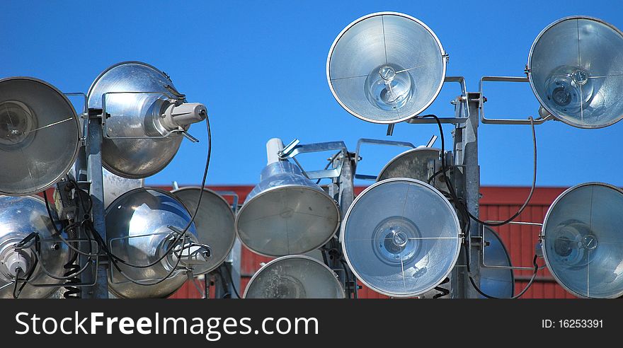 Flood lights on display at a rental business.