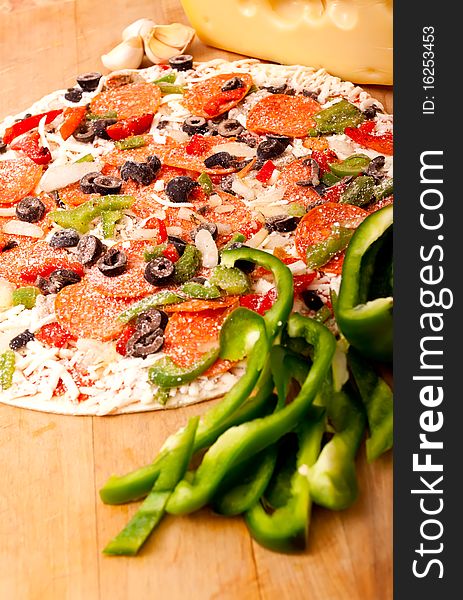 Raw Pizza With Vegetables And Pepperoni