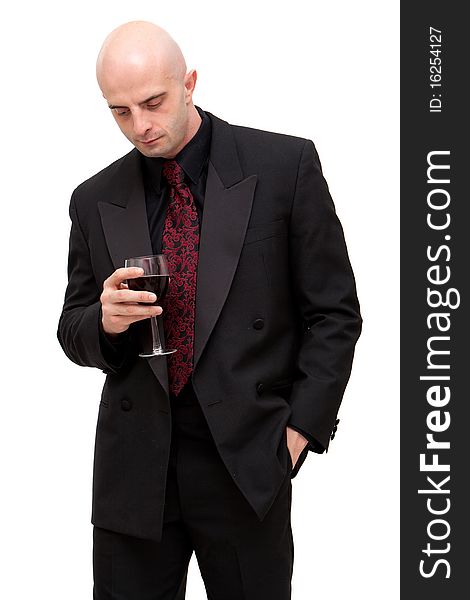 Young business man in dark suit holding a glass of wine. Young business man in dark suit holding a glass of wine