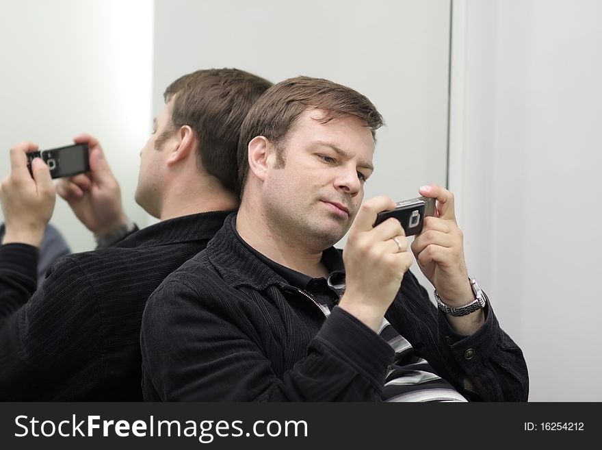 A young man with mobile phone. A young man with mobile phone