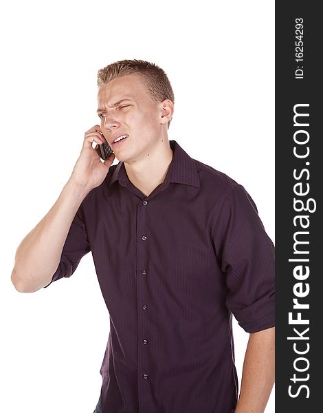 A young man on his phone with a shocked expression on his face. A young man on his phone with a shocked expression on his face.