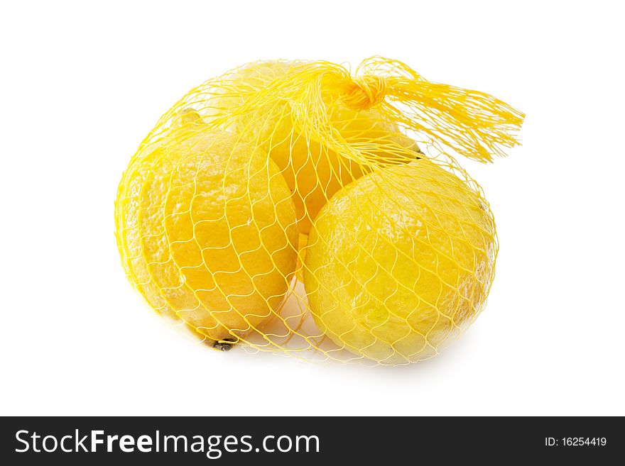 A yellow bunch of three lemons isolated over white
