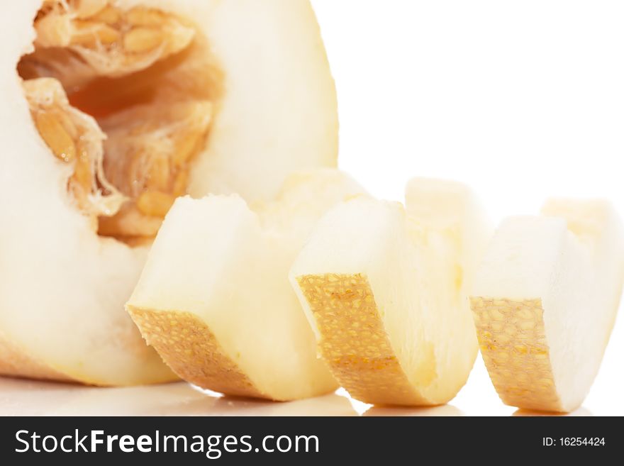 Pieces of juicy melon isolated over white