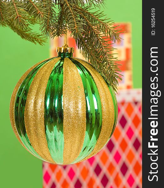 Christmas presents in background of an large tree decoration