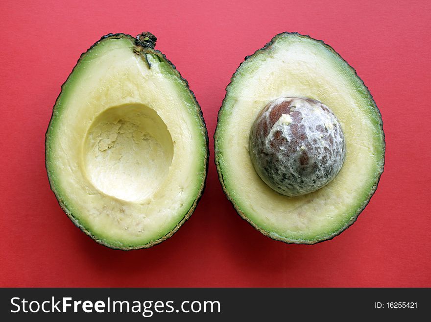 Two halfs fresh ripe avocado in isolated
