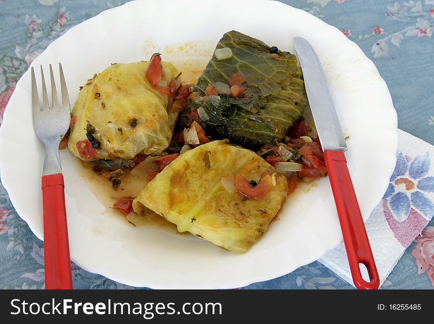Stewed cabbage stuffed minead meat and rice with vegetables. Stewed cabbage stuffed minead meat and rice with vegetables