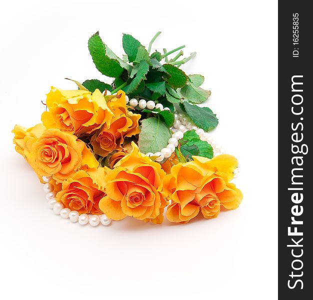 Bouquet of orange roses with a pearl necklace