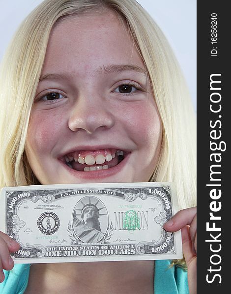 Happy girl holding a one million dollar bill. Happy girl holding a one million dollar bill.