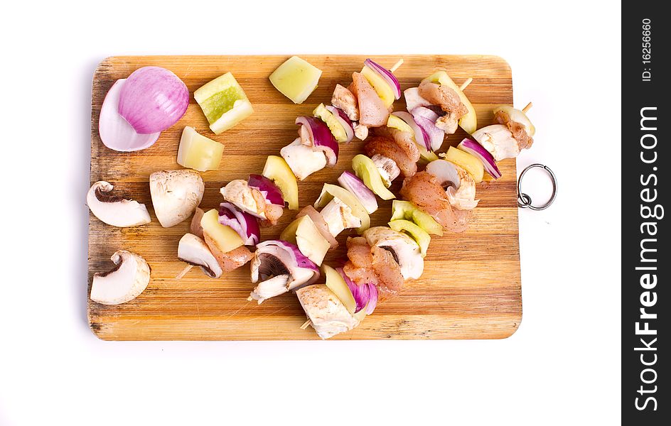 Raw chicken and vegetables skewers. Raw chicken and vegetables skewers