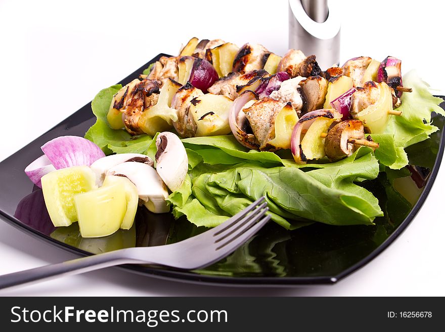 Cooked chicken and vegetables skewers. Cooked chicken and vegetables skewers
