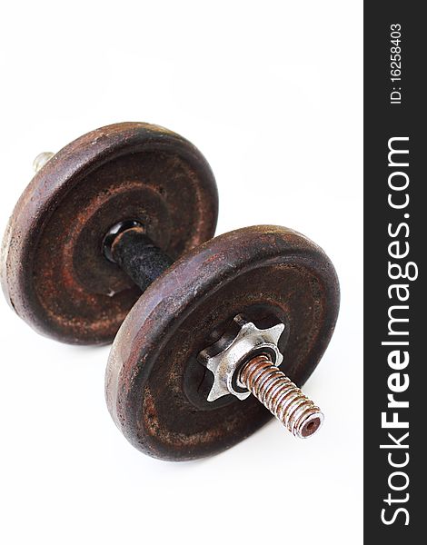 Neglected and rusting dumbbell isolated in white background