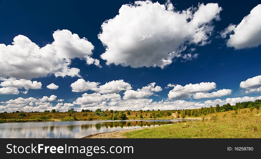 Wonderful View Of Lake And Autumnal Meadow.