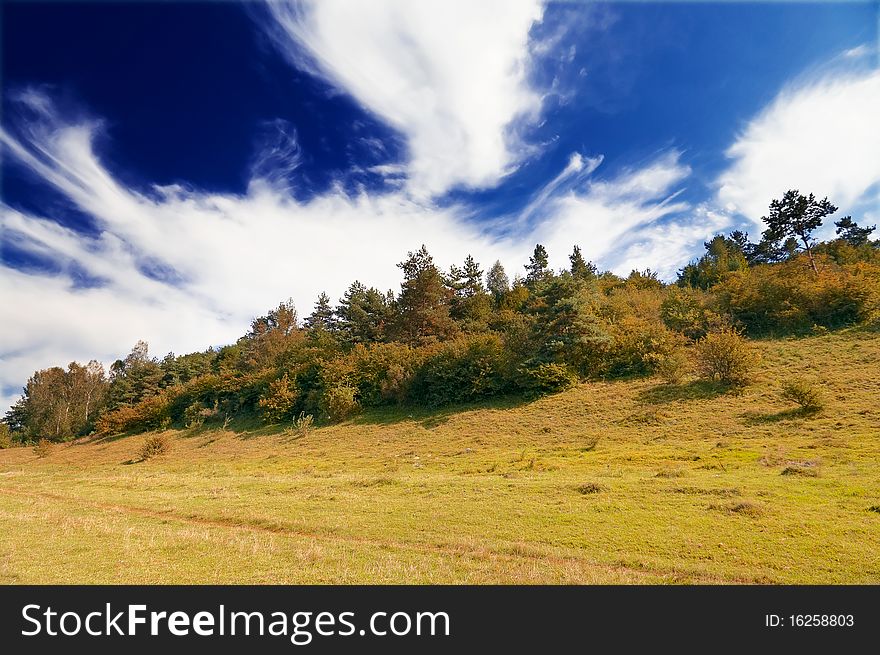 Autumnal hill and wonderful blue sky with clouds. Autumnal hill and wonderful blue sky with clouds.
