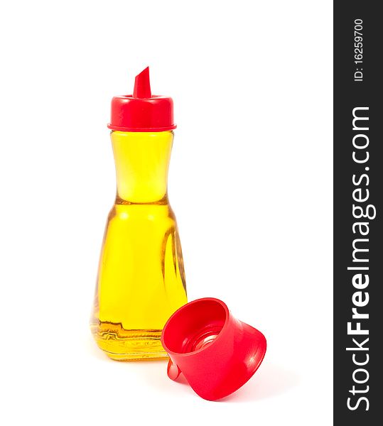 Oil in a bottle on a white background