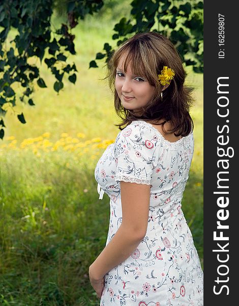 Girl, smile, yellow flowers, leafs and grass. Girl, smile, yellow flowers, leafs and grass