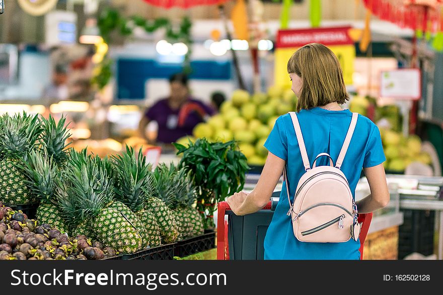 Young woman in supermarket on Bali island. Indonesia.