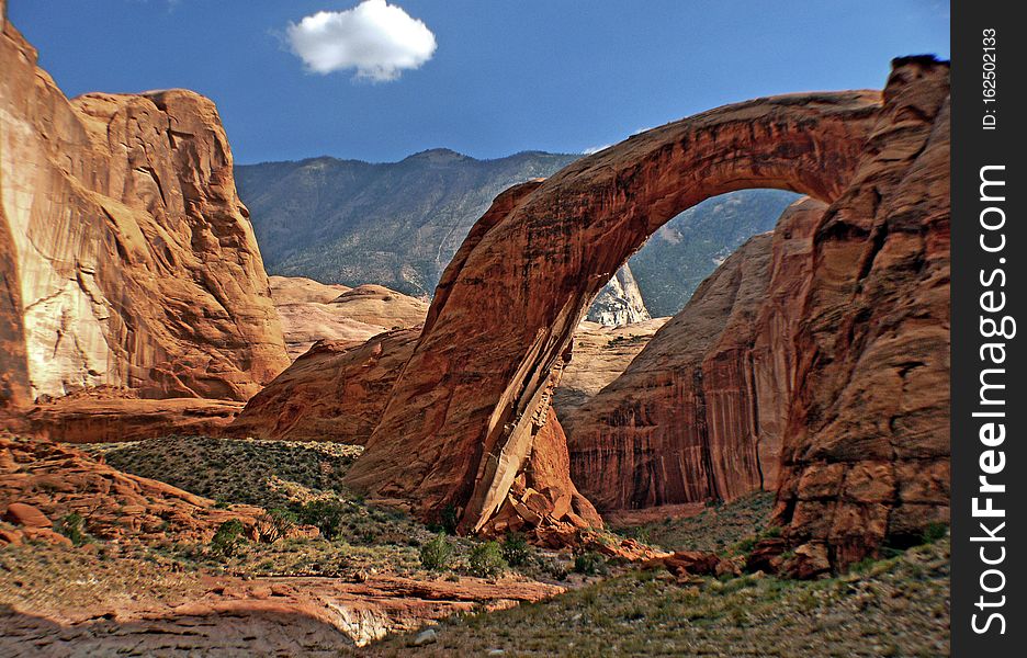 Rainbow Bridge National Monument is administered by Glen Canyon National Recreation Area, southern Utah, United States. Rainbow Bridge is often described as the world&#x27;s highest natural bridge. The span of Rainbow Bridge was reported in 1974 by the Bureau of Reclamation to be 275 feet &#x28;84 m&#x29;, but a laser measurement in 2007 has resulted in a span of 234 feet &#x28;71 m&#x29;.[citation needed] At the top it is 42 feet &#x28;13 m&#x29; thick and 33 feet &#x28;10 m&#x29; wide. The bridge, which is of cultural importance to a number of area Native American tribes, has been designated a Traditional Cultural Property by the National Park Service. Rainbow Bridge National Monument is administered by Glen Canyon National Recreation Area, southern Utah, United States. Rainbow Bridge is often described as the world&#x27;s highest natural bridge. The span of Rainbow Bridge was reported in 1974 by the Bureau of Reclamation to be 275 feet &#x28;84 m&#x29;, but a laser measurement in 2007 has resulted in a span of 234 feet &#x28;71 m&#x29;.[citation needed] At the top it is 42 feet &#x28;13 m&#x29; thick and 33 feet &#x28;10 m&#x29; wide. The bridge, which is of cultural importance to a number of area Native American tribes, has been designated a Traditional Cultural Property by the National Park Service.