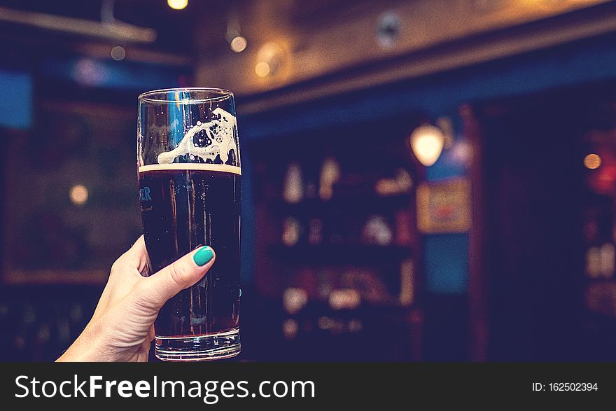 Woman Hand With Glass Of Beer