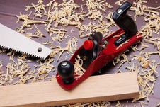 Red Plane, Wooden Brick, Handsaw Royalty Free Stock Image Red Plane, Wooden Brick, Handsaw Royalty Free Stock Image