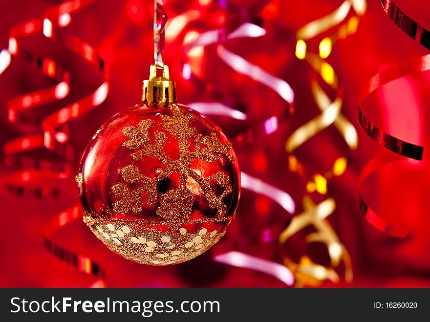 Christmas red bauble and ribbons on red background. Christmas red bauble and ribbons on red background